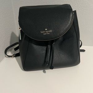 Black Kate Spade backpack with zipper flap